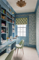 A study interior by Annsley Interiors featuring walls wallpapered in Belfour wallpaper in Cobalt, a damask print in deep blue tones. The room includes a desk, shelves, and soft lighting, creating a calm and refined workspace.